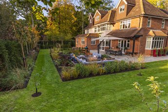 Large family garden with areas for entertaining, play and growing fruit and vegetables.