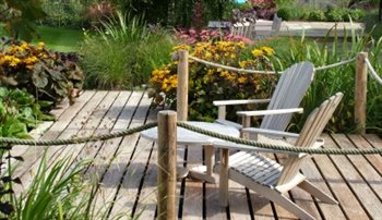 Timber viewing deck overlooking a centuries old pond.  In the heart of Suffolk, this farmhouse garden, overlooks the wonderful countryside around the market town of Framlingham. 
