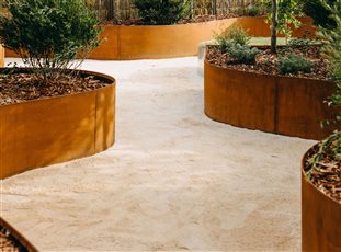 Corten Steel Raised Garden Beds of the Flex variety, arrive as flat packed panels and flex to shape, safely rolled tops, discreet join systems. Heights of 240mm, 400mm, 560mm.