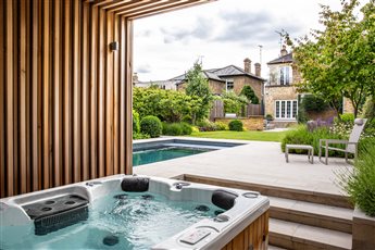 London garden covered hot tub and pool area 