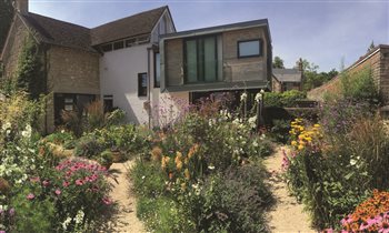Historic Courtyard with contemporary extension and a colourful gravel garden