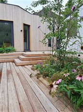 Tree top larch deck garden. Part of an overall masterplan for a wildlife friendly garden on a steep slope in a city back garden. Designed whilst part of the Artisan Landscapes Design Studio team. 