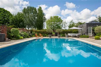 Pool area within a large Sussex country garden.