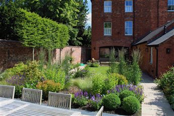 A formal town garden with naturalistic planting