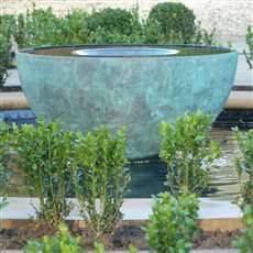 The Specular water sculpture is normally sold as a self contained water feature, with everything you need, ready to be installed. However we can offer bespoke designs, such as being installed into ponds, as shown here.