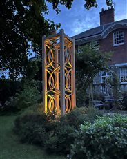 The Nodum works extremely well as a focal feature, here positioned at the centre of a flower bed set against the backdrop of a period property. And adding up-lighting creates a really magical effect at night.