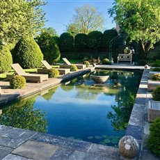 A period property in a beautiful setting. Tills were brought in to carry out the design and installation of the natural pond, with central fountain. An organic solution to produce crystal clear water.