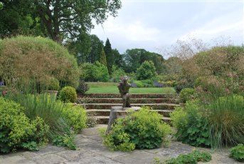 The client's favourite statue, called Dancers, was placed centre stage, thus helping him to come on board and have the rest of his garden designed by a garden designer.