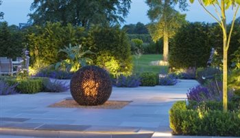 Lighting within the garden, highlighting both hard landscape and soft landscape features.