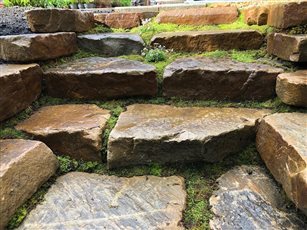 Hardwearing with a natural textured surface, this rockery stone is one of the most versatile stones that we bring to the market place. With a flat top and bottom surface, this attractive rockery is ideal for building layers and creating height